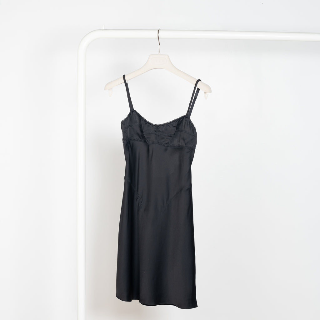 The Mini Waterlily Dress by Anna October is a signature lightweight summer dress with an open back and lingerie details