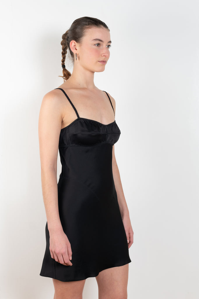 The Mini Waterlily Dress by Anna October is a signature lightweight summer dress with an open back and lingerie details