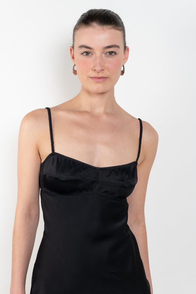 The Mini Waterlily Dress by Anna October is a signature lightweight summer dress with an open back and lingerie details