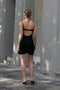 The Mini Waterlily Dress by Anna October is a signature lightweight summer dress with an open back and lingerie details