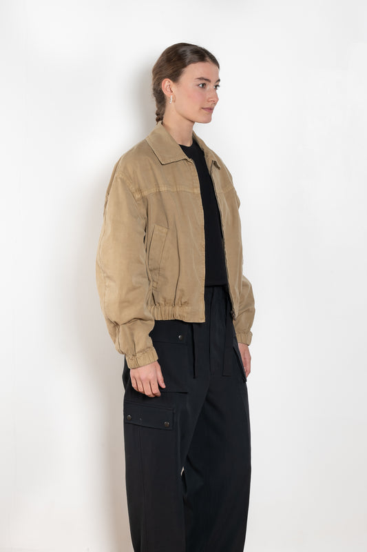 The Gabardine Blouson by Auralee is a short blouson jacket with a natural dye and soft feel