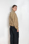 The Gabardine Blouson by Auralee is a short blouson jacket with a natural dye and soft feel