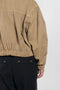 The Gabardine Blouson by Auralee is a short blouson jacket with a natural dye and soft feel