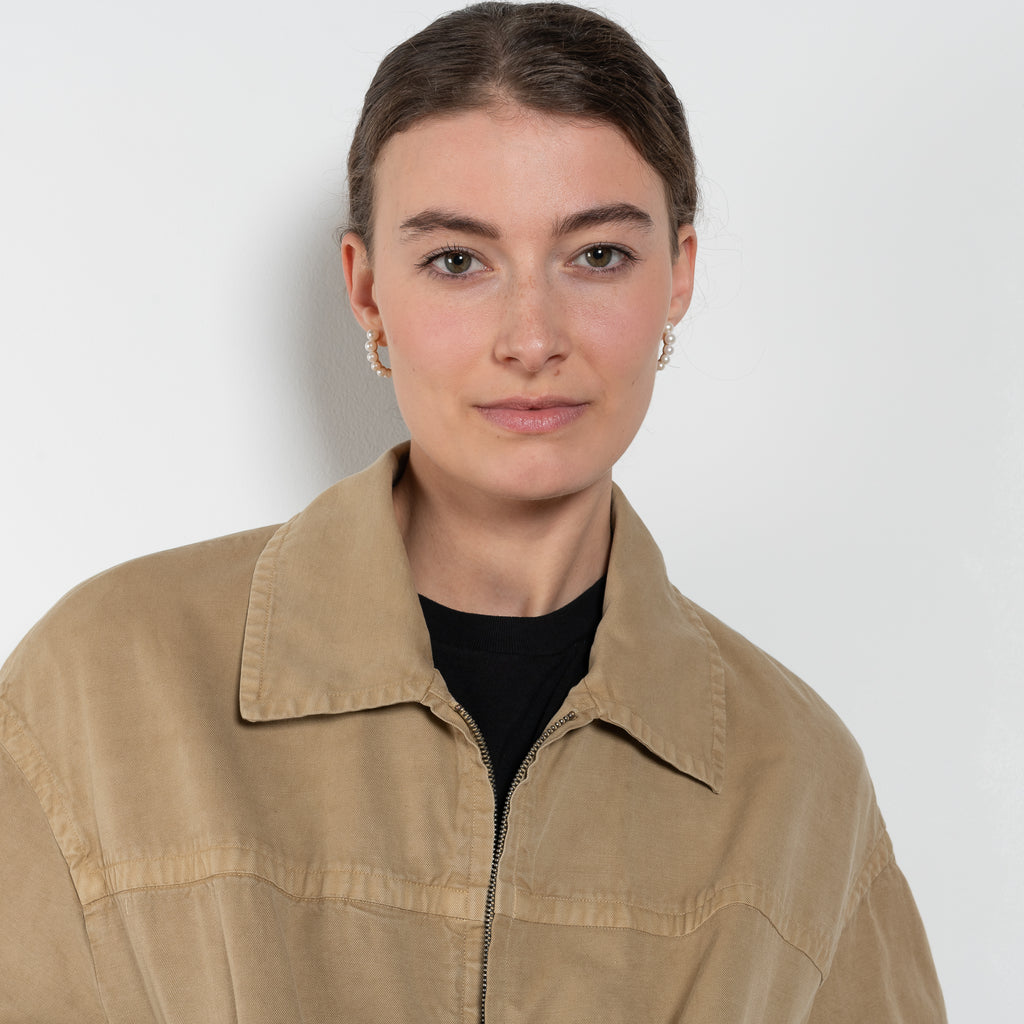 The Gabardine Blouson by Auralee is a short blouson jacket with a natural dye and soft feel