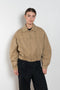 The Gabardine Blouson by Auralee is a short blouson jacket with a natural dye and soft feel