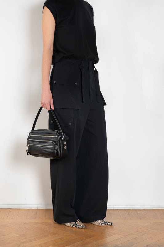 The Lightweight Cargo Pants by Auralee is a relaxed trouser in a lightweight cotton and wool blend with cargo details