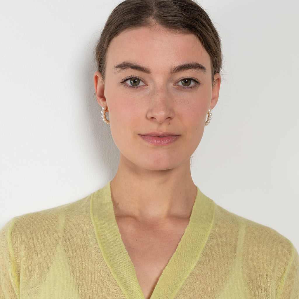 The Mohair Sheer Cardigan by Auralee is a fine knitted cardigan with a delicate, luxurious transparency