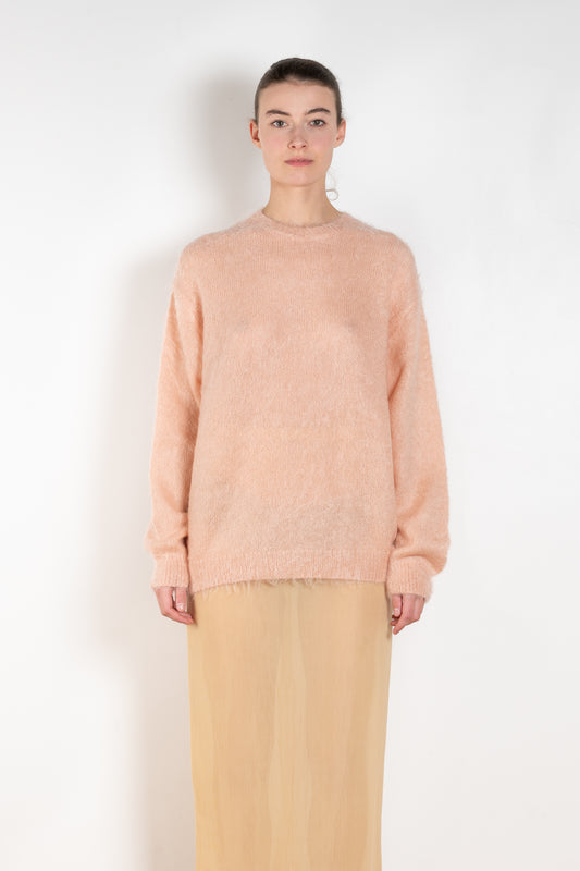 The Brushed Mohair Knit by Auralee is a knitted sweater woven from delicately spun Super Kid Mohair