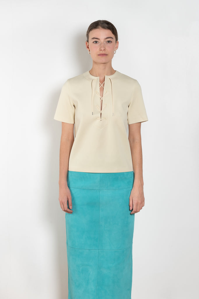 The Tied Neck Top by Auralee is a structured top with a tied neckline detail