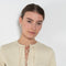 The Tied Neck Top by Auralee is a structured top with a tied neckline detail