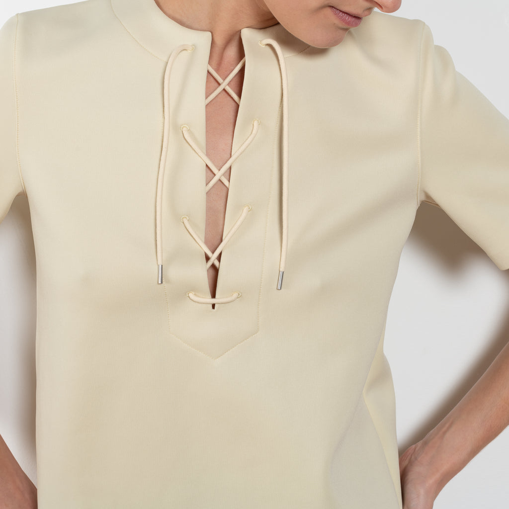 The Tied Neck Top by Auralee is a structured top with a tied neckline detail