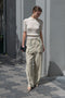 The Lightweight Cargo Pants by Auralee is a relaxed trouser in a lightweight cotton and wool blend with cargo details