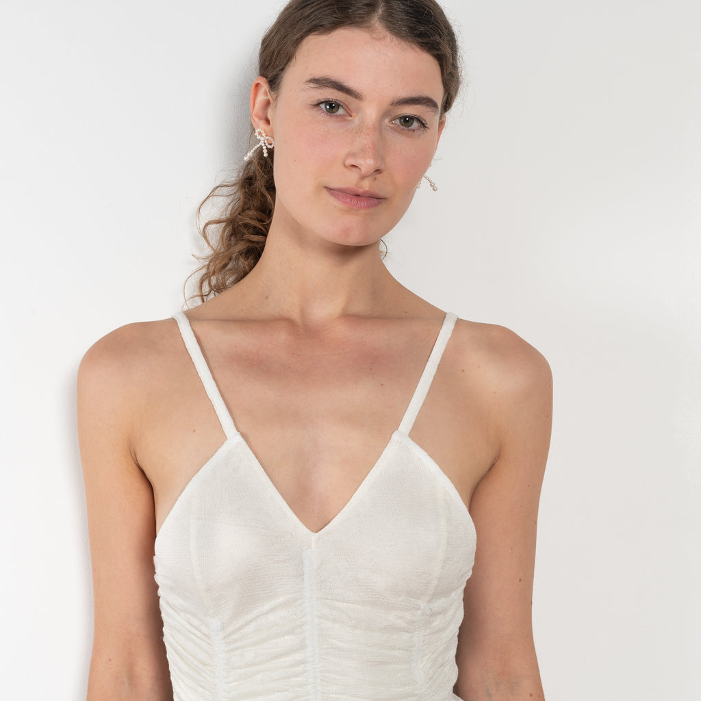 The Sirene Lace Body by Bite is crafted from fine floral lace jersey, featuring subtle ruching along the fitted bodice and BITE’s signature Sirene-shaped neckline.