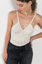 The Sirene Lace Body by Bite is crafted from fine floral lace jersey, featuring subtle ruching along the fitted bodice and BITE’s signature Sirene-shaped neckline.
