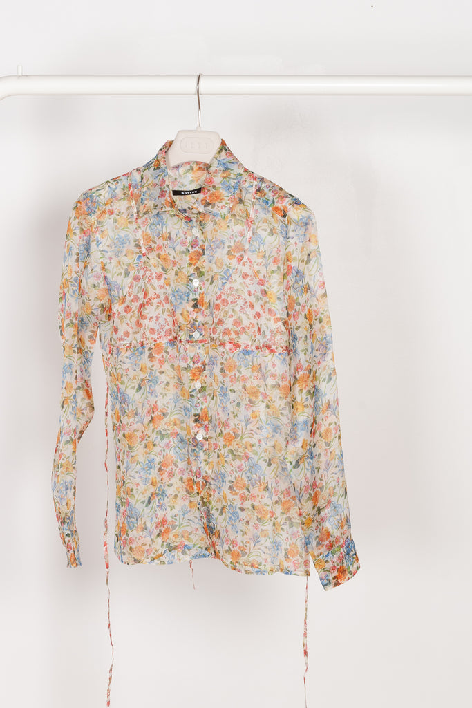 The Bikini Shirt by Botter is a floral silk shirt with a integrated bikini detail to tie in the back