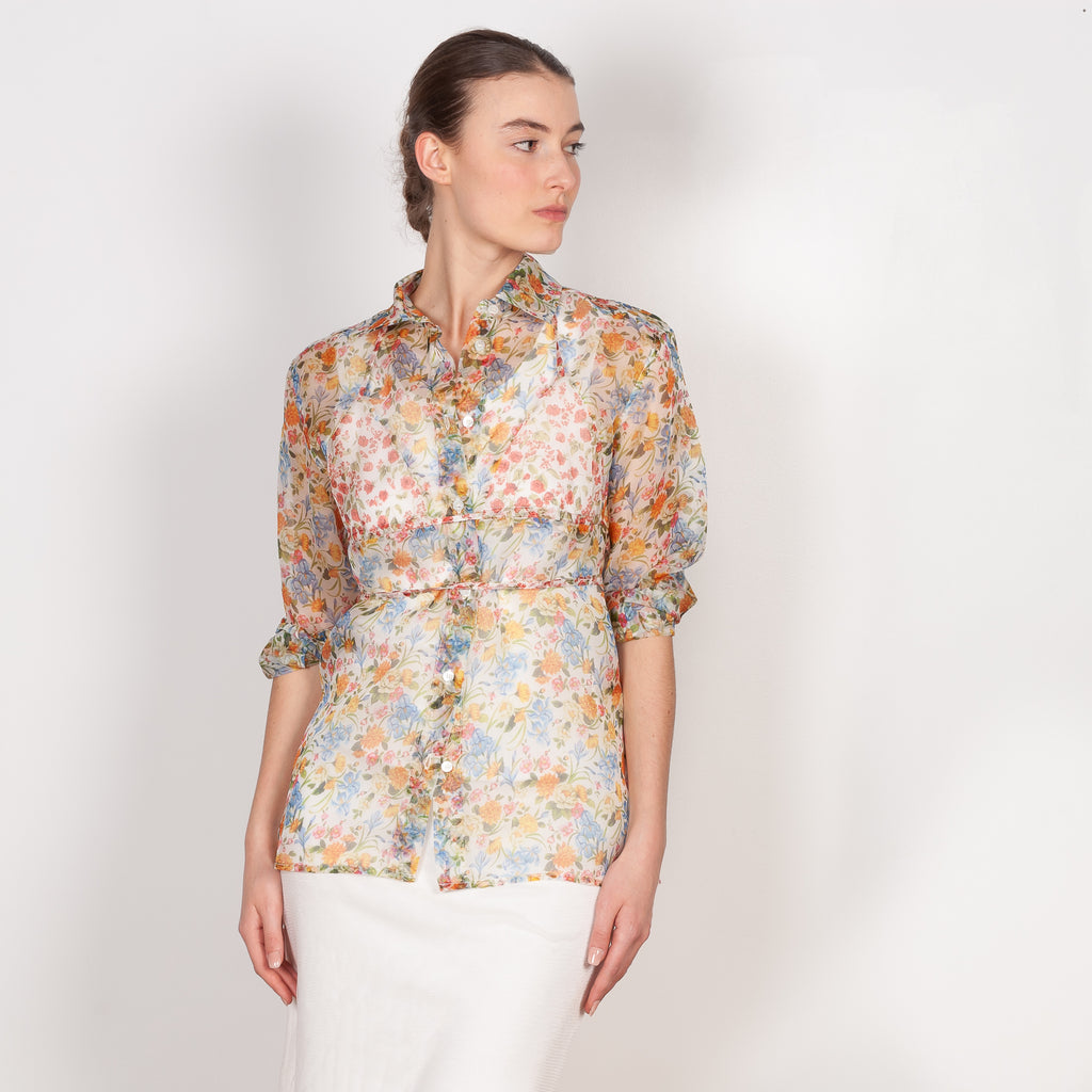 The Bikini Shirt by Botter is a floral silk shirt with a integrated bikini detail to tie in the back