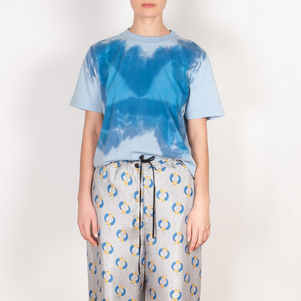 The Pyjama Trousers by Botter are relaxed silk trousers with a seasonal fish print