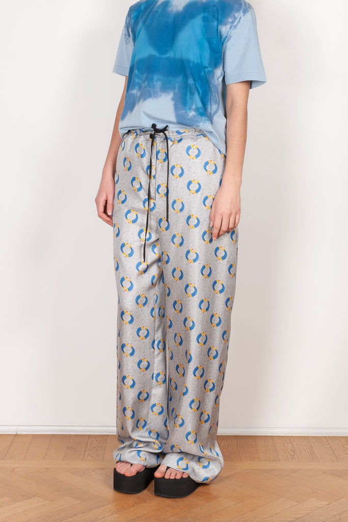 The Pyjama Trousers by Botter are relaxed silk trousers with a seasonal fish print