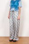 The Pyjama Trousers by Botter are relaxed silk trousers with a seasonal fish print