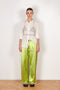 The Pyjama Trousers by Botter are relaxed silk drawstring trousers in a vibrant lime color