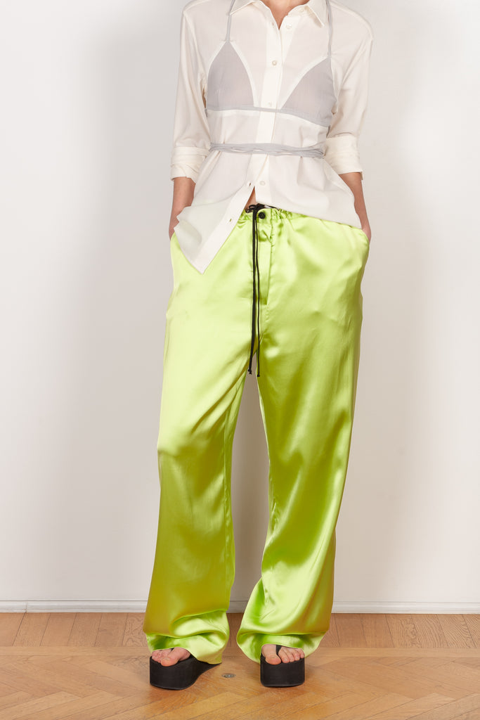 The Pyjama Trousers by Botter are relaxed silk drawstring trousers in a vibrant lime color