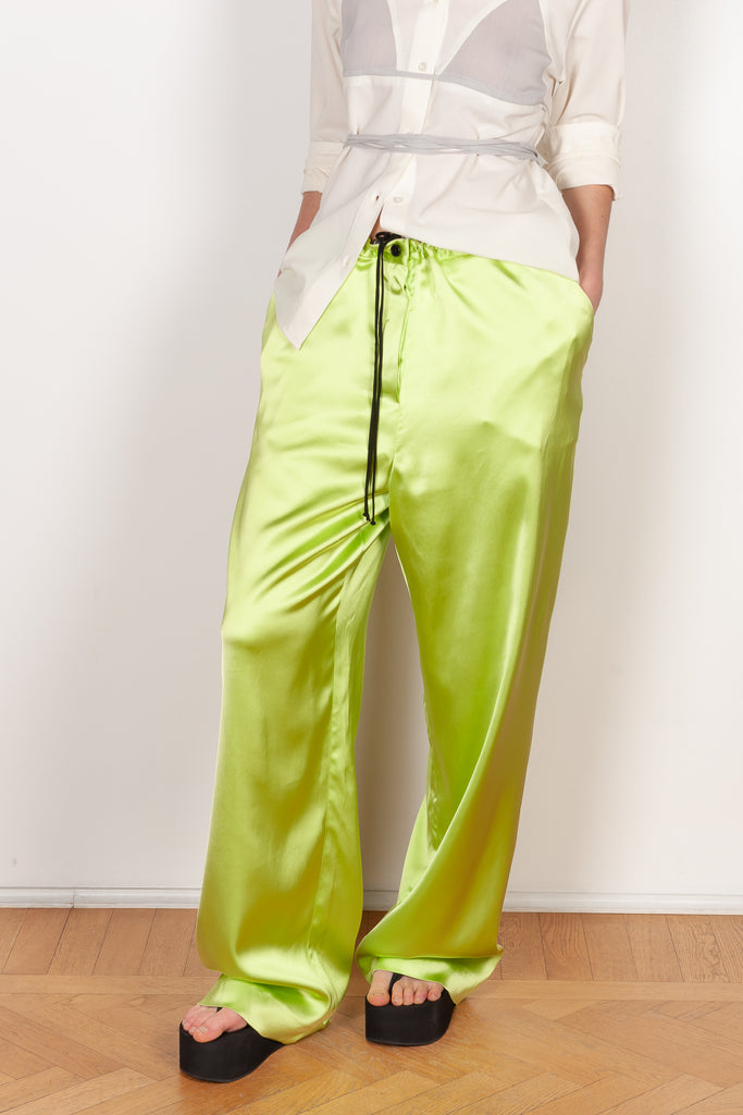 The Pyjama Trousers by Botter are relaxed silk drawstring trousers in a vibrant lime color