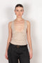 The Deep Cut Tank Top by Coperni is a fitted tank top with a deep cut at the front