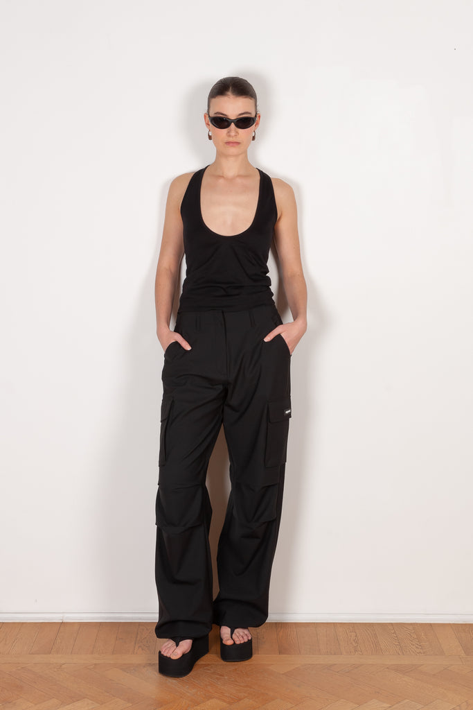 The Deep Cut Tank Top by Coperni is a fitted tank top with a deep cut at the front