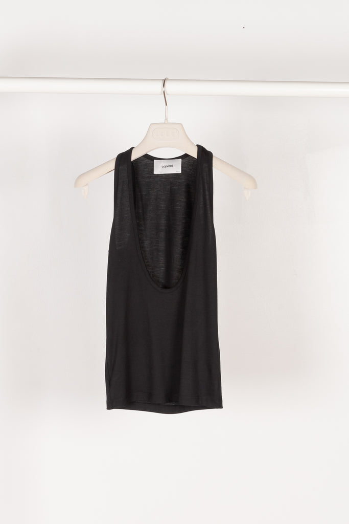 The Deep Cut Tank Top by Coperni is a fitted tank top with a deep cut at the front