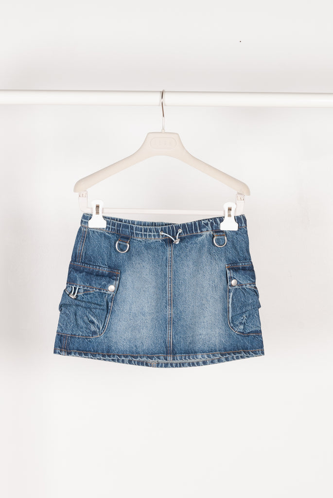 The Denim Cargo Skirt by Coperni are low waisted mini skirts with a signature cargo details