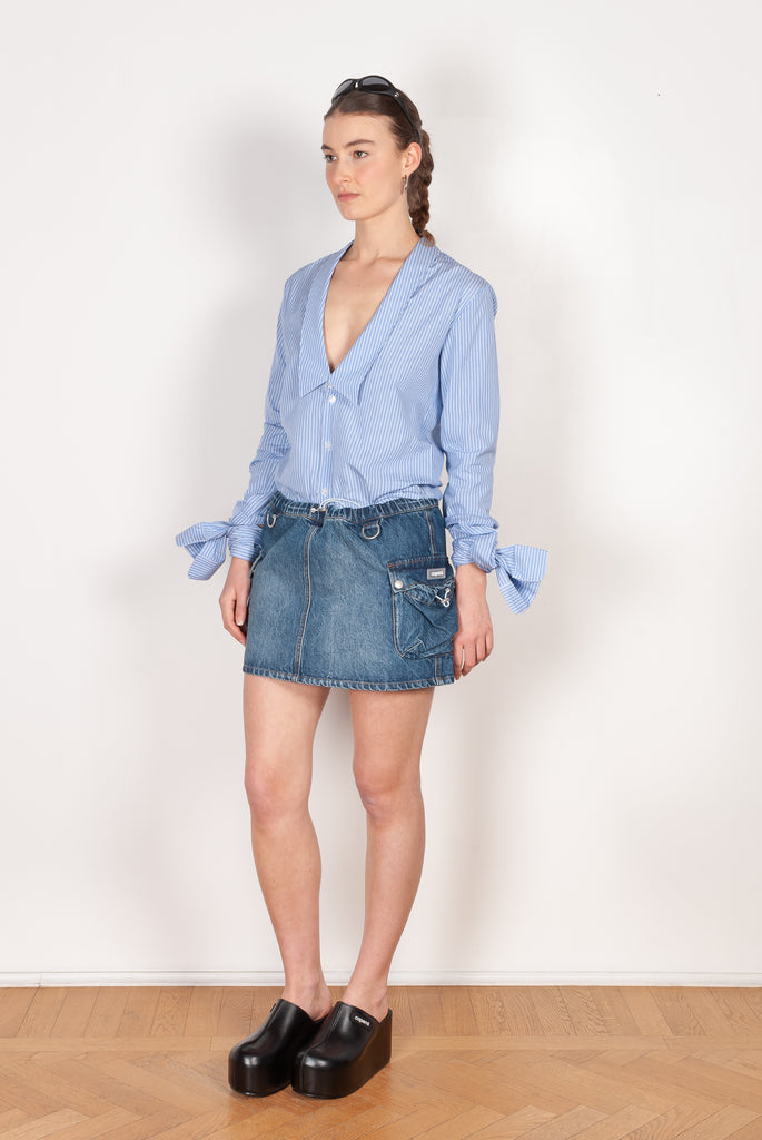 The Denim Cargo Skirt by Coperni are low waisted mini skirts with a signature cargo details