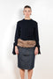 The Faux Fur Hybrid Denim Skirt by Coperni is a denim skirt with an optic low waist and faux fur waistband at the front