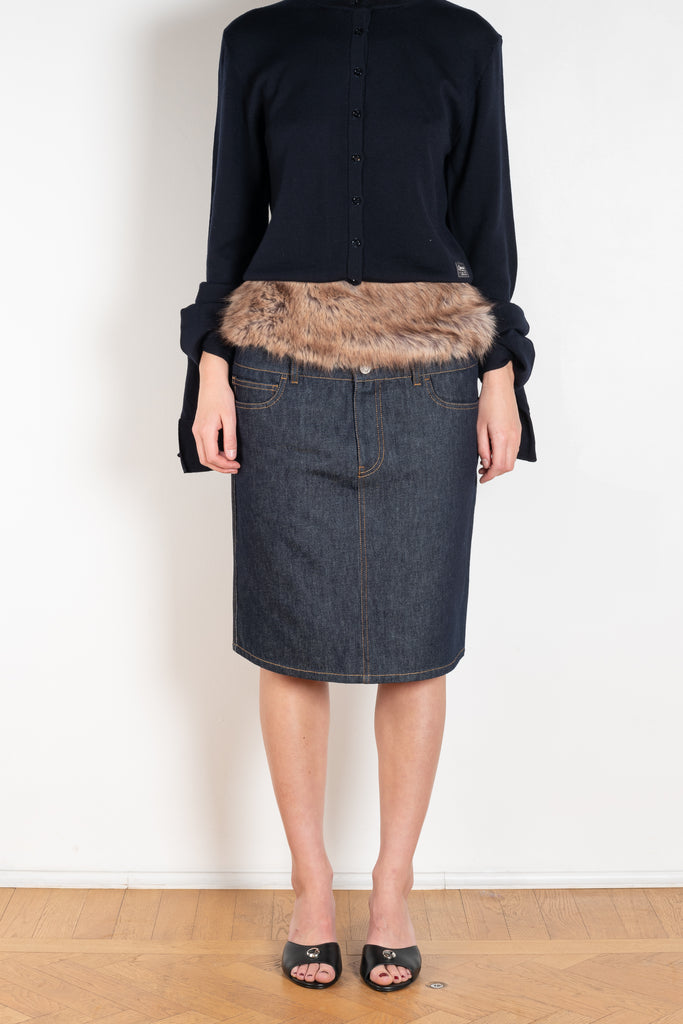 The Faux Fur Hybrid Denim Skirt by Coperni is a denim skirt with an optic low waist and faux fur waistband at the front