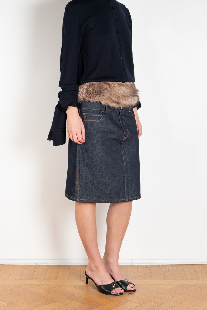 The Faux Fur Hybrid Denim Skirt by Coperni is a denim skirt with an optic low waist and faux fur waistband at the front