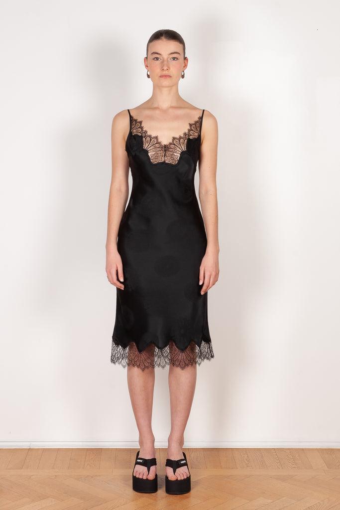 The Jacquard Cymatic Dress by Coperni is a lingerie inspired silk dress with a delicate scalloped lace neckline