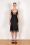 The Jacquard Cymatic Dress by Coperni is a lingerie inspired silk dress with a delicate scalloped lace neckline