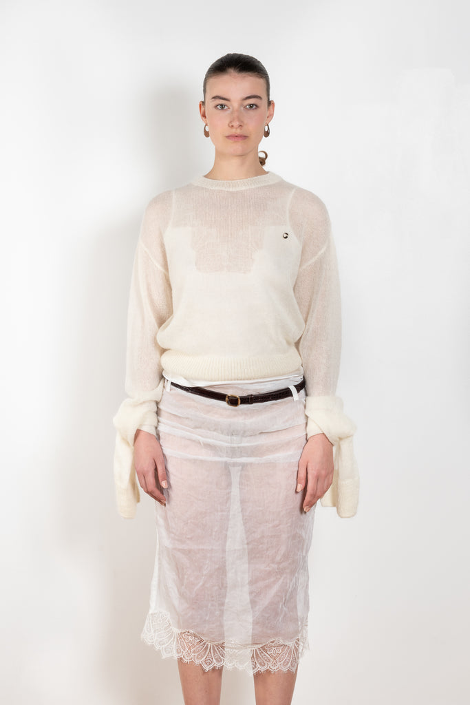 The Knotted Sleeves Polo Jumper by Coperni is a cropped sweater with extra long sleeves which are meant to be tied up in a knot