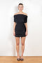 The Pleated Off Shoulder Dress by Coperni is a shoulder baring pleated black mini dress
