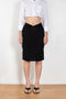 The Triangle Skirt by Coperni is a low waist fine jersey skirt with a small Logo at the te front and a triangle cut-out at the back