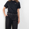 The Studded Tailored Trouser by Coperni is a mid rise trouser with a long wide leg and allover studs on the side and waistline