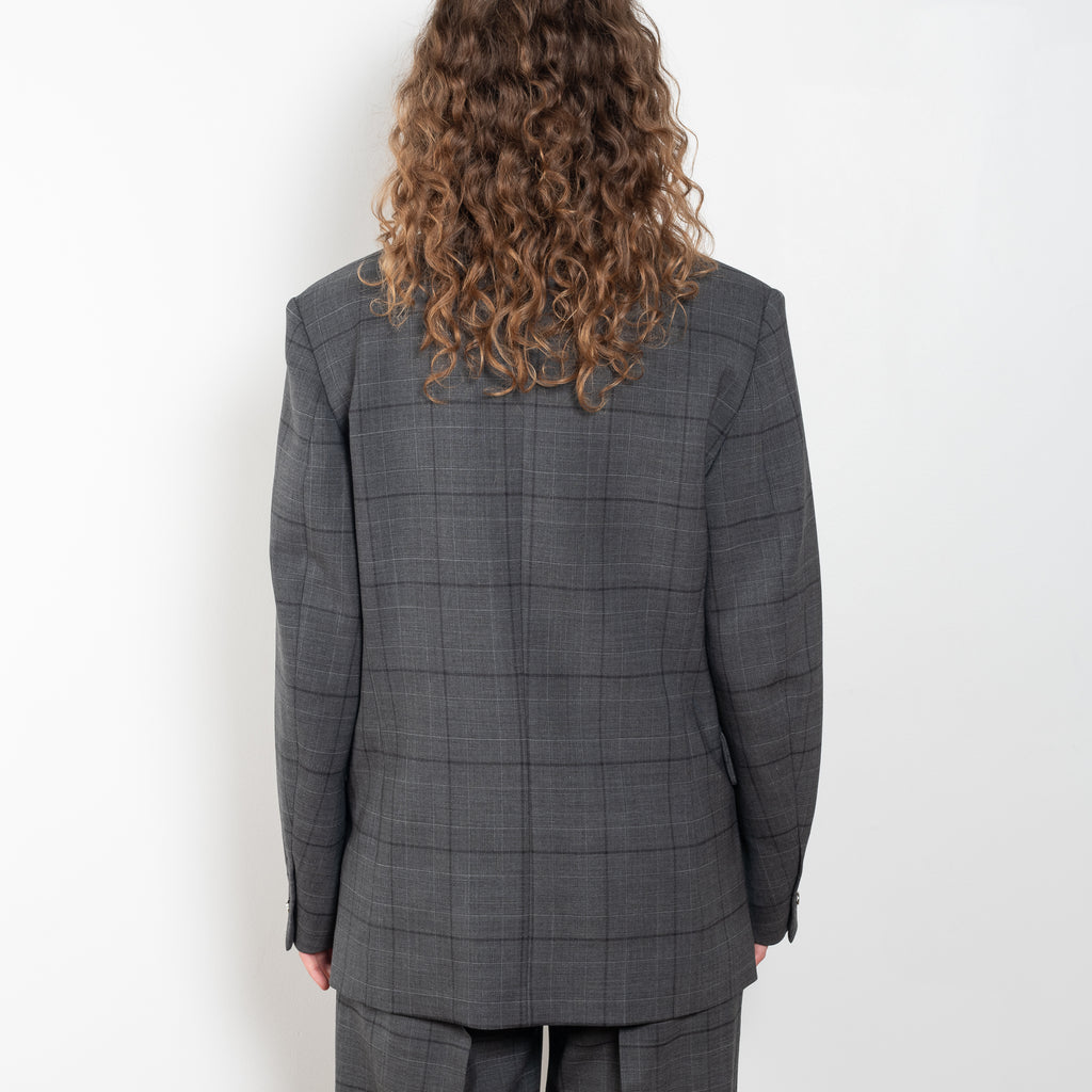 The Tailored Jacket by Coperni is a double breasted jacket with a relaxed fit in a seasonal windowpane check