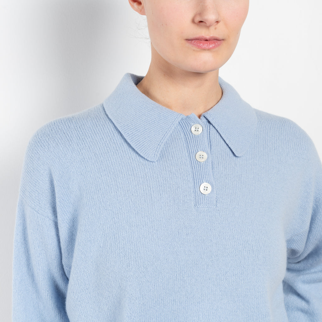 The Edith Plain Polo by &DAUGHTER is a vintage sports-inspired polo knit in soft Scottish-Spun Lambswool