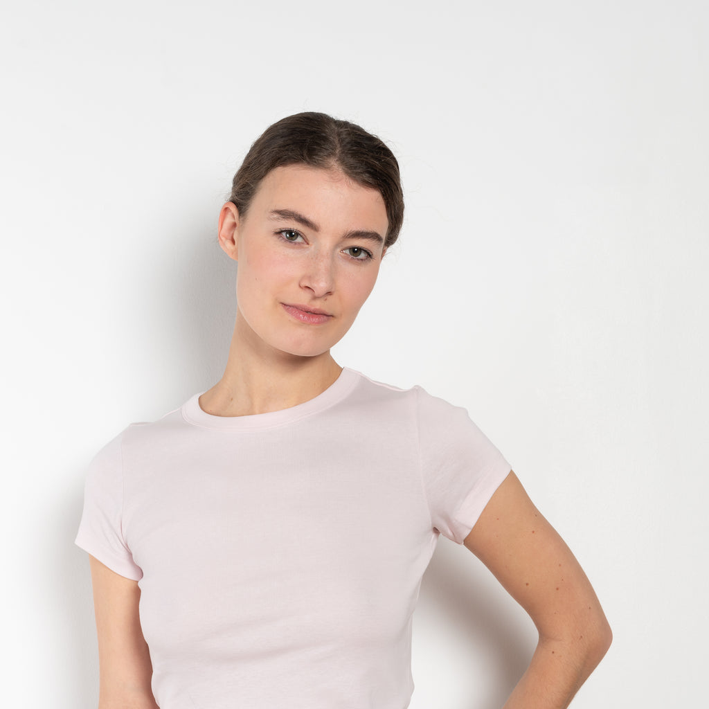 The Car Baby Tee is a fitted t-shirt with a short sleeve. This classic silhouette comes with a double stitched cut-off seam on the back.