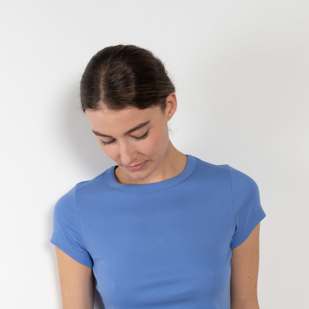 The Car Baby Tee is a fitted t-shirt with a short sleeve
