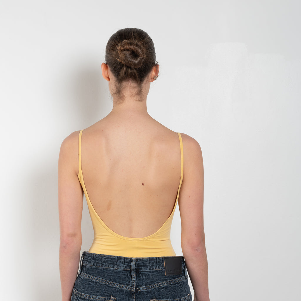 The Carli Body is a camisole thong bodysuit with a scoop neckline and low back.&nbsp;