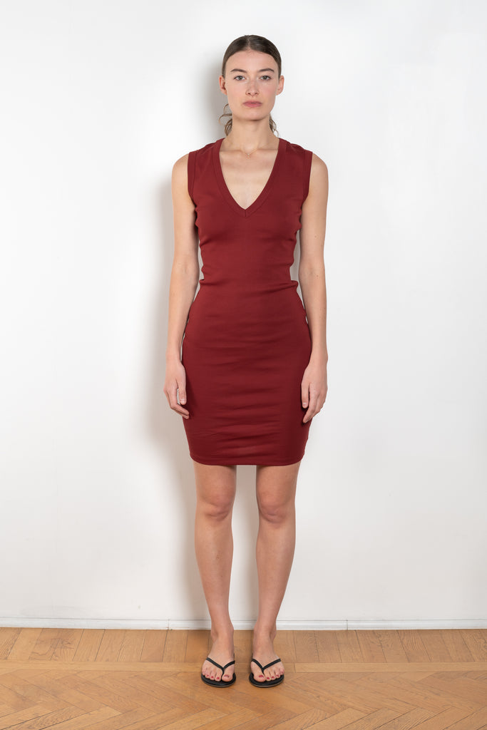 The Dewi Dress by Flore Flore is a fitted crew neck tank dress with a double stitched cut-off seam on the back.