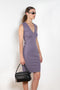 The Dewi Dress by Flore Flore is a fitted crew neck tank dress with a double stitched cut-off seam on the back.