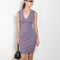 The Dewi Dress by Flore Flore is a fitted crew neck tank dress with a double stitched cut-off seam on the back.