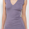 The Dewi Dress by Flore Flore is a fitted crew neck tank dress with a double stitched cut-off seam on the back.