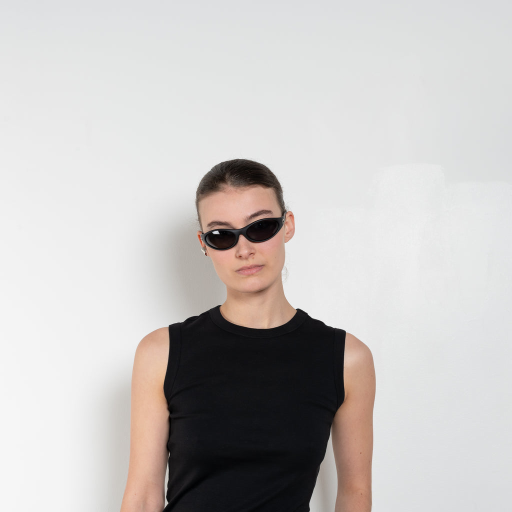 The Esme Tank by Flore Floreis a&nbsp;fitted crew neck tank top with a double stitched cut-off seam on the back